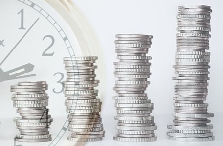 coins stacked in 4 ascending columns. investment