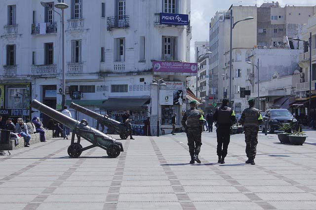 military patrolling streets near canons